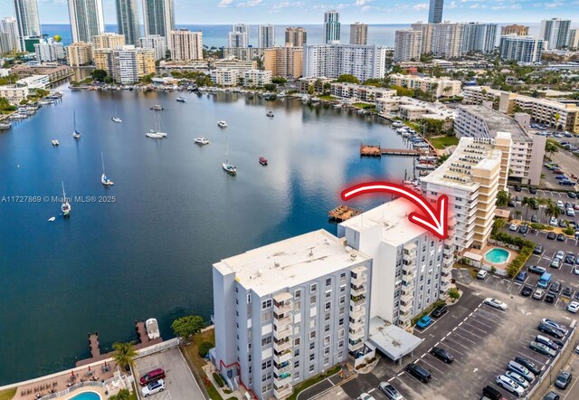 birds eye view of property featuring a water view