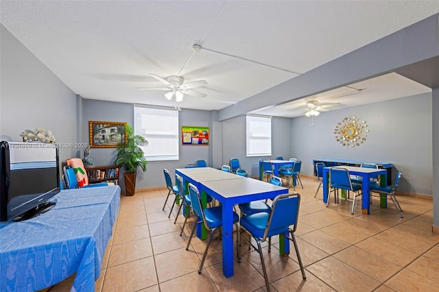 430 Golden Isles Dr Unit 707, Hallandale Beach, FL 33009 - dining area featuring ceiling fan, light tile patterned floors, and baseboards