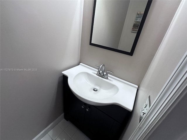 bathroom with tile patterned flooring and vanity