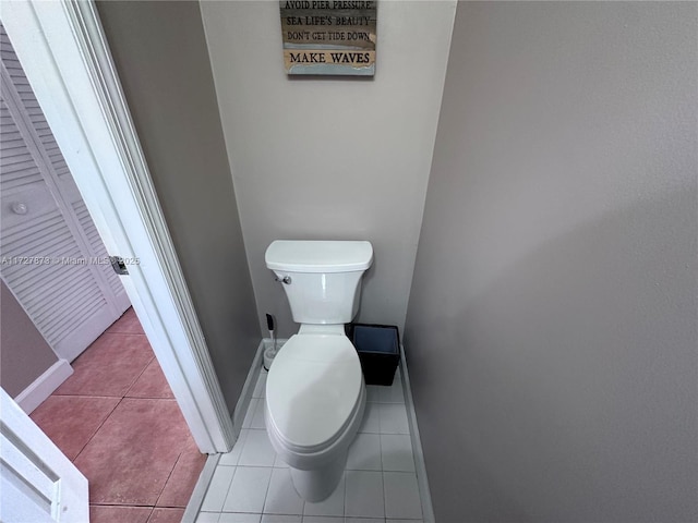 bathroom featuring toilet and tile patterned floors