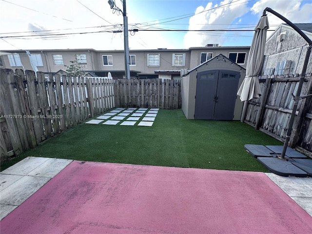 view of yard featuring a storage unit and a patio