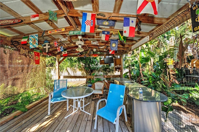 wooden deck featuring exterior bar