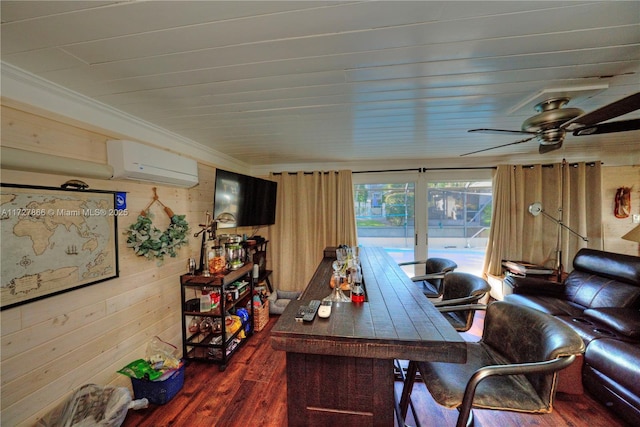 home office featuring an AC wall unit, dark hardwood / wood-style floors, ornamental molding, wood walls, and ceiling fan