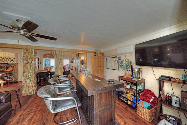 bar with hardwood / wood-style flooring, wood walls, a wall unit AC, ceiling fan, and ornamental molding