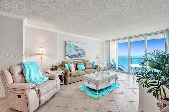 living room featuring floor to ceiling windows, a textured ceiling, ornamental molding, a water view, and light tile patterned floors