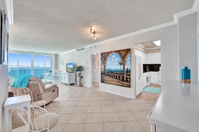 living room featuring floor to ceiling windows, a textured ceiling, light tile patterned floors, and ornamental molding