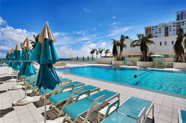 view of swimming pool featuring a patio