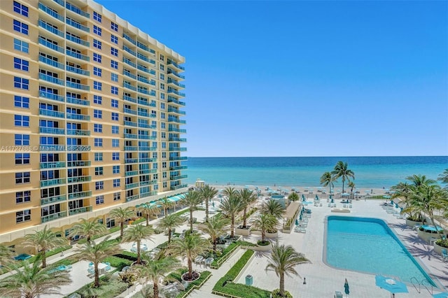 exterior space with a patio area and a water view