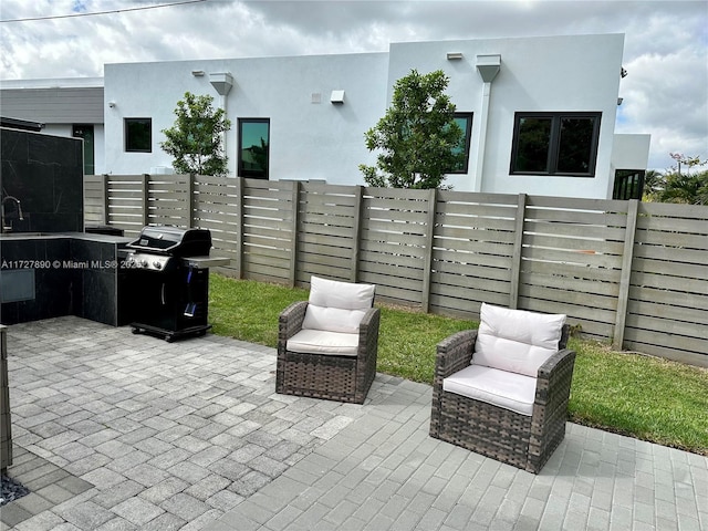 view of patio / terrace with sink and grilling area