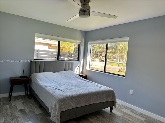 bedroom featuring hardwood / wood-style floors and ceiling fan