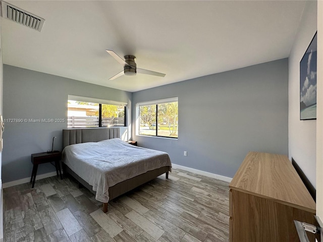 bedroom featuring ceiling fan and light hardwood / wood-style floors