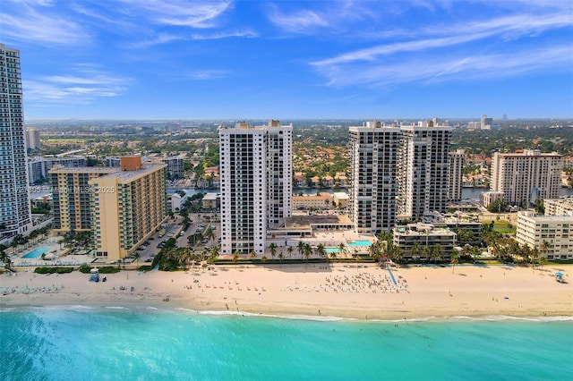 aerial view with a water view and a view of the beach