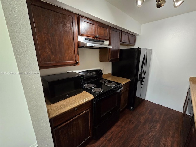 kitchen with dark brown cabinetry, dark hardwood / wood-style floors, and black appliances