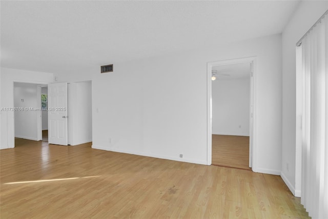 unfurnished room with light hardwood / wood-style flooring