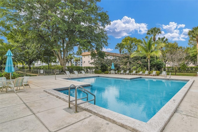 view of swimming pool featuring a patio