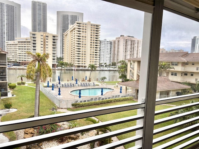 view of pool with a water view