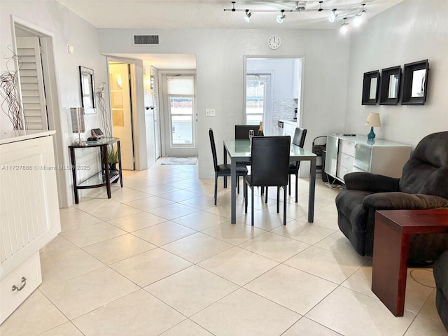 dining room featuring light tile patterned flooring