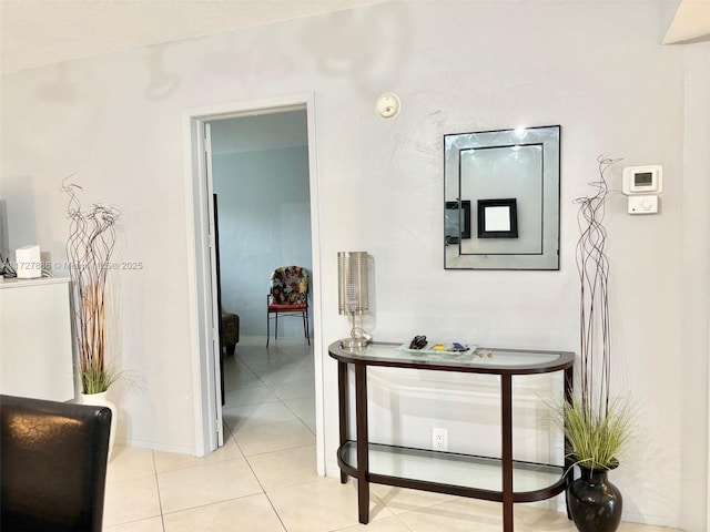 corridor featuring light tile patterned floors