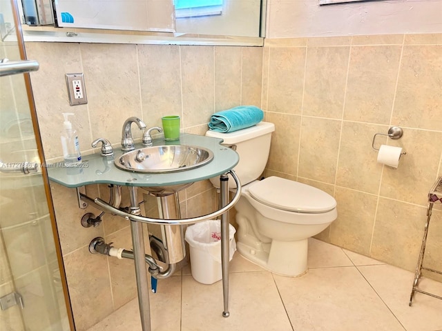 bathroom featuring toilet and tile patterned flooring