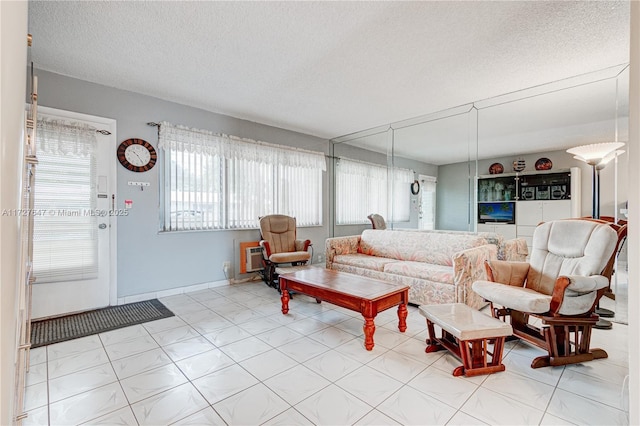 living room with a textured ceiling