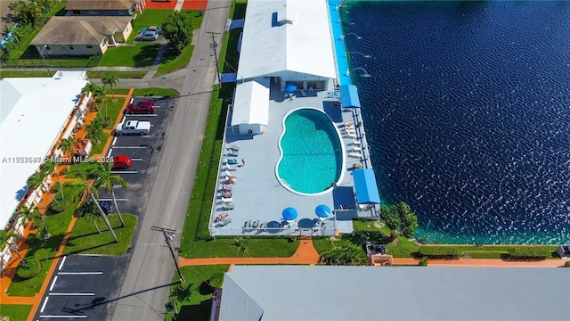 birds eye view of property with a water view