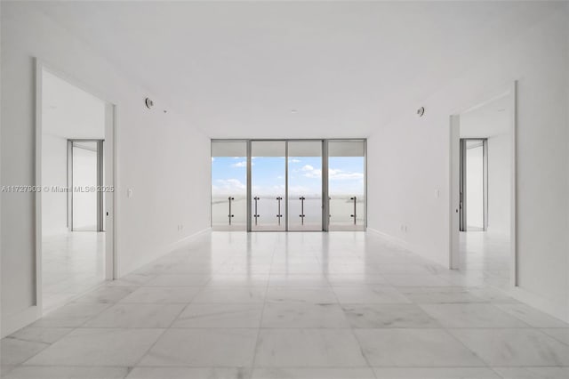 empty room with floor to ceiling windows