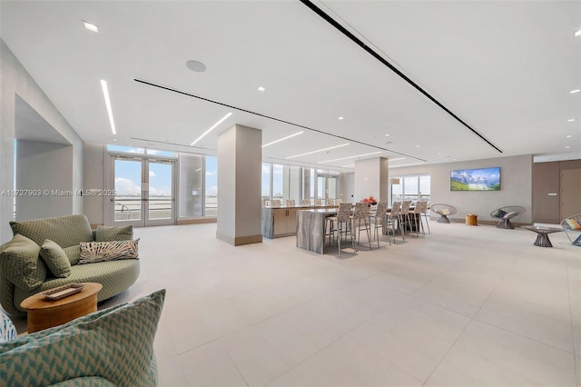 living room with floor to ceiling windows