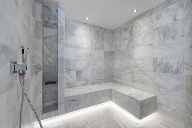 bathroom featuring a tile shower