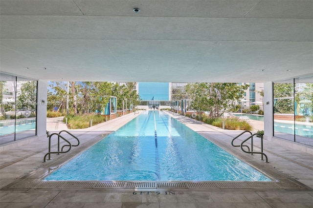 view of pool featuring a patio area