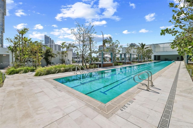 view of pool featuring a patio area