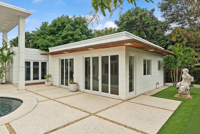 rear view of house with a patio