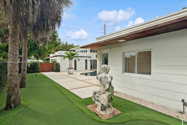 view of yard featuring a patio and fence