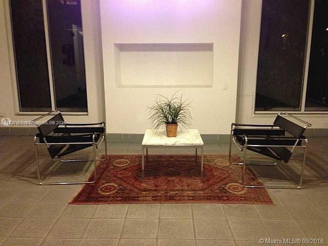 living area with tile patterned flooring