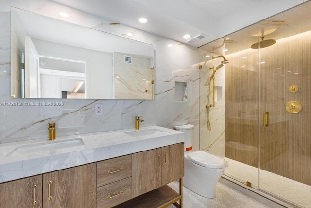 bathroom with a shower with shower door, vanity, backsplash, and toilet