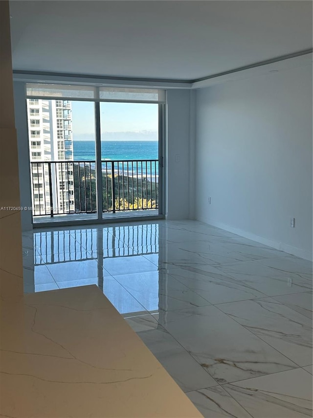 empty room featuring a water view