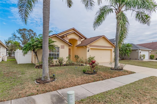 view of front of property with a garage and a front lawn