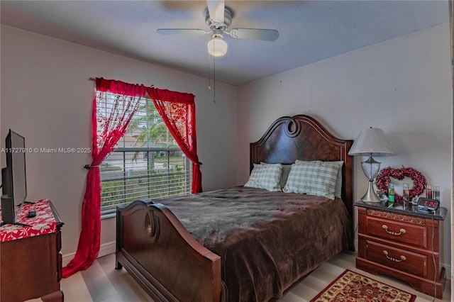 bedroom featuring ceiling fan and light wood-type flooring