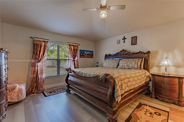 bedroom featuring ceiling fan and hardwood / wood-style floors