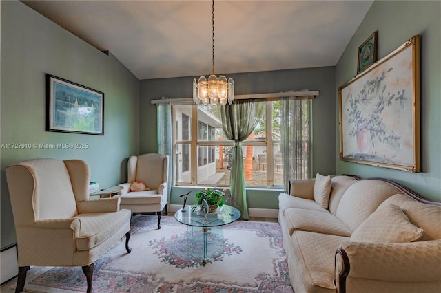 living room with lofted ceiling and a chandelier