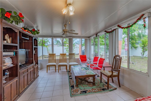 sunroom / solarium featuring ceiling fan and plenty of natural light