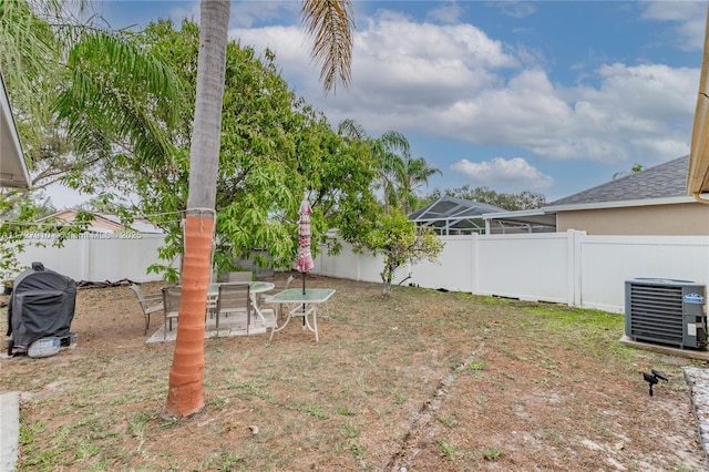 view of yard with central AC