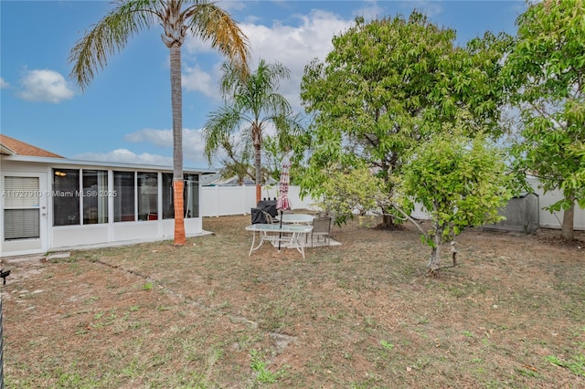 view of yard with a sunroom