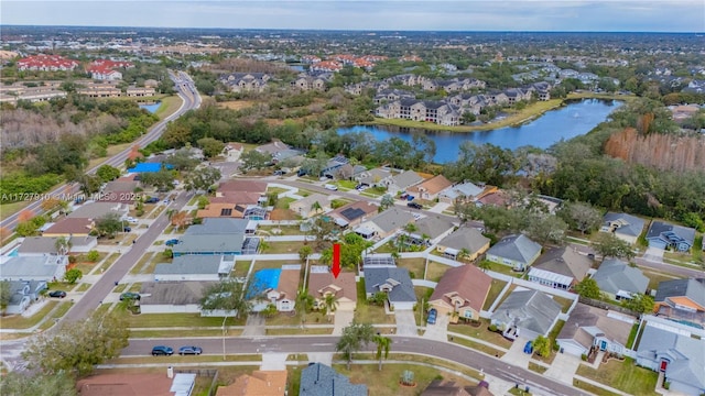 birds eye view of property with a water view