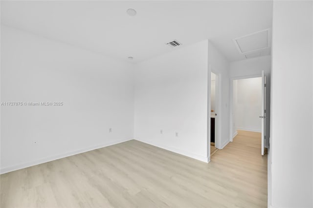 empty room with light hardwood / wood-style floors