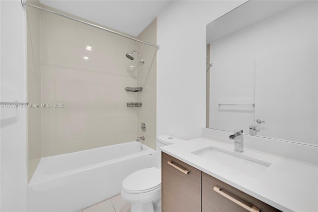 full bathroom featuring toilet, tiled shower / bath, tile patterned floors, and vanity