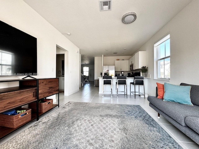 living room featuring light tile patterned floors