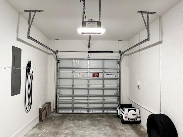 garage featuring electric panel and a garage door opener