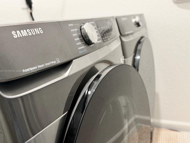 interior details featuring washing machine and clothes dryer