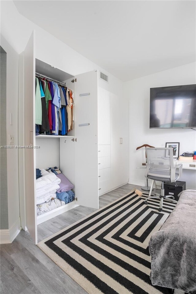 bedroom with light hardwood / wood-style flooring