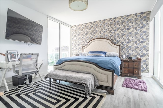 bedroom with wood-type flooring